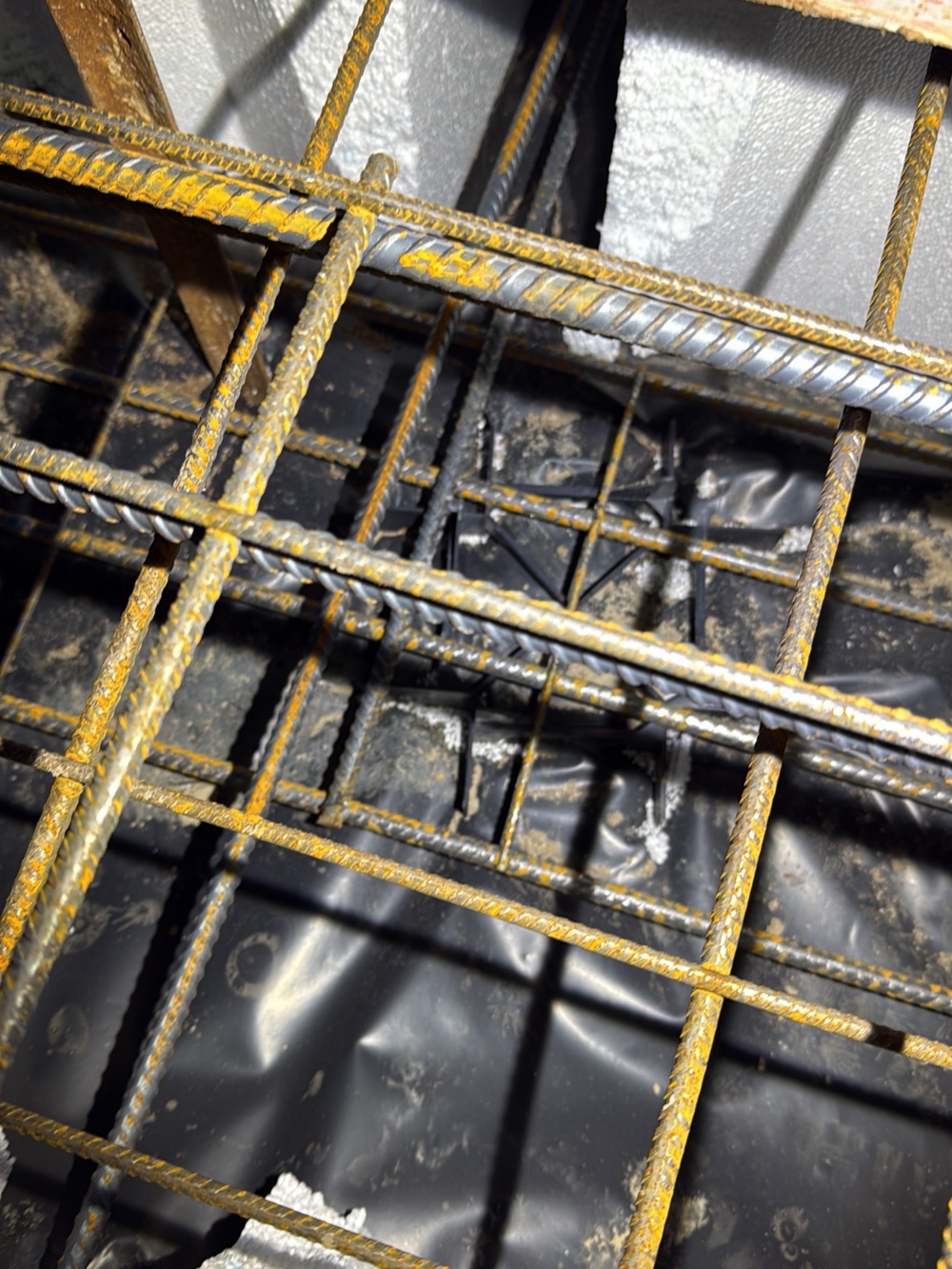 Reinforcement inadequately supported before a pour, recorded on a slab pre-pour inspection in Nar Nar Goon, 5 km from Pakenham East