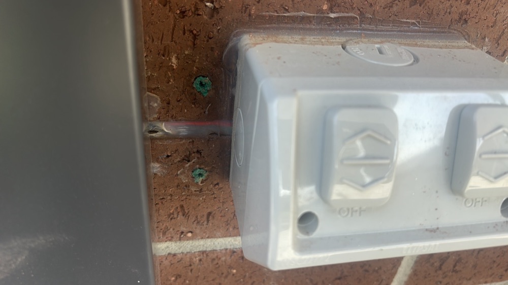 Non-compliant external power point wiring recorded as a safety hazard on a pre-handover inspection in Nar Nar Goon, 5 km from Pakenham East