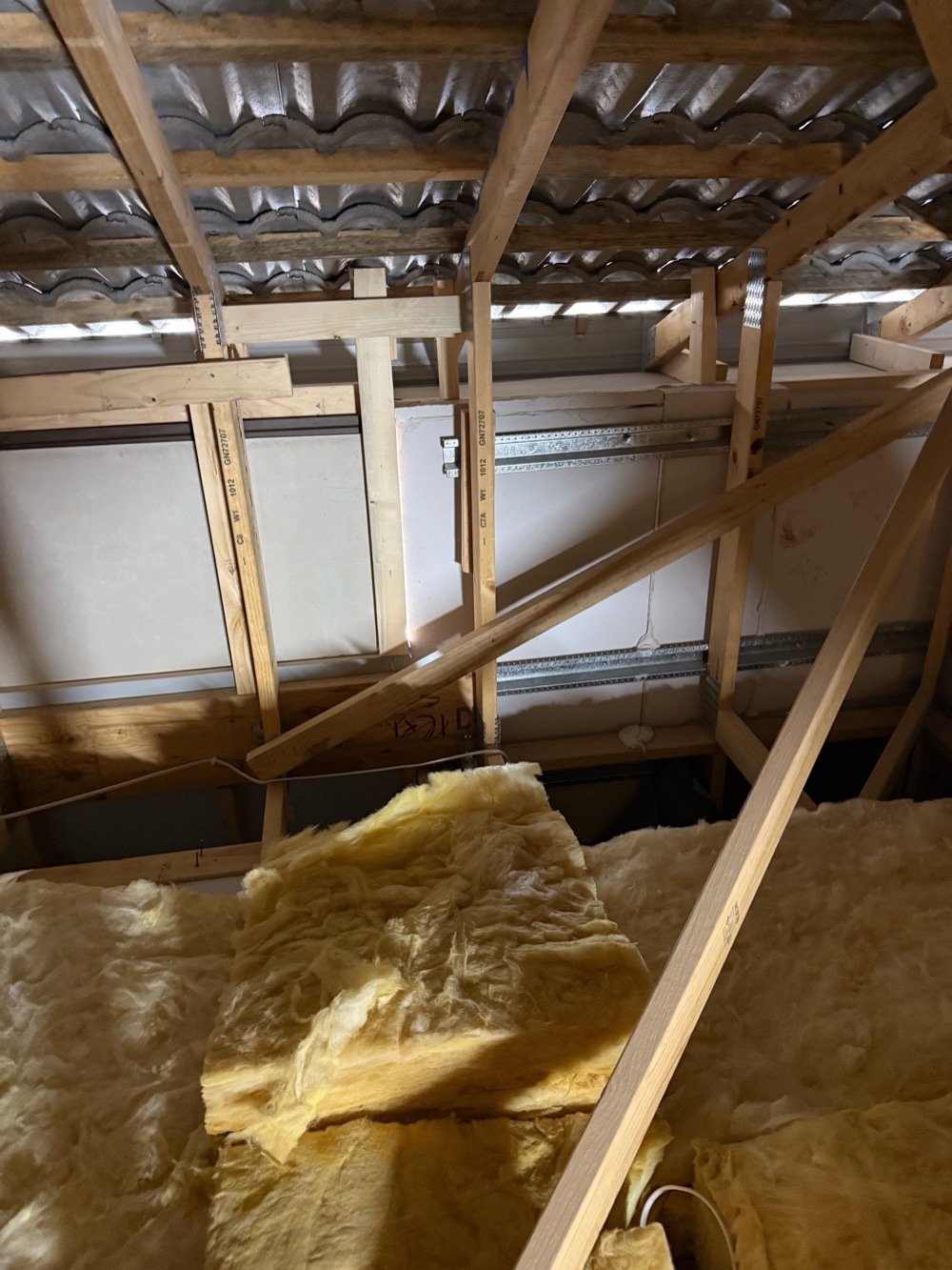 Unsealed junction between cladding types, recorded on a pre-handover inspection in Pakenham, 4 km from Pakenham East